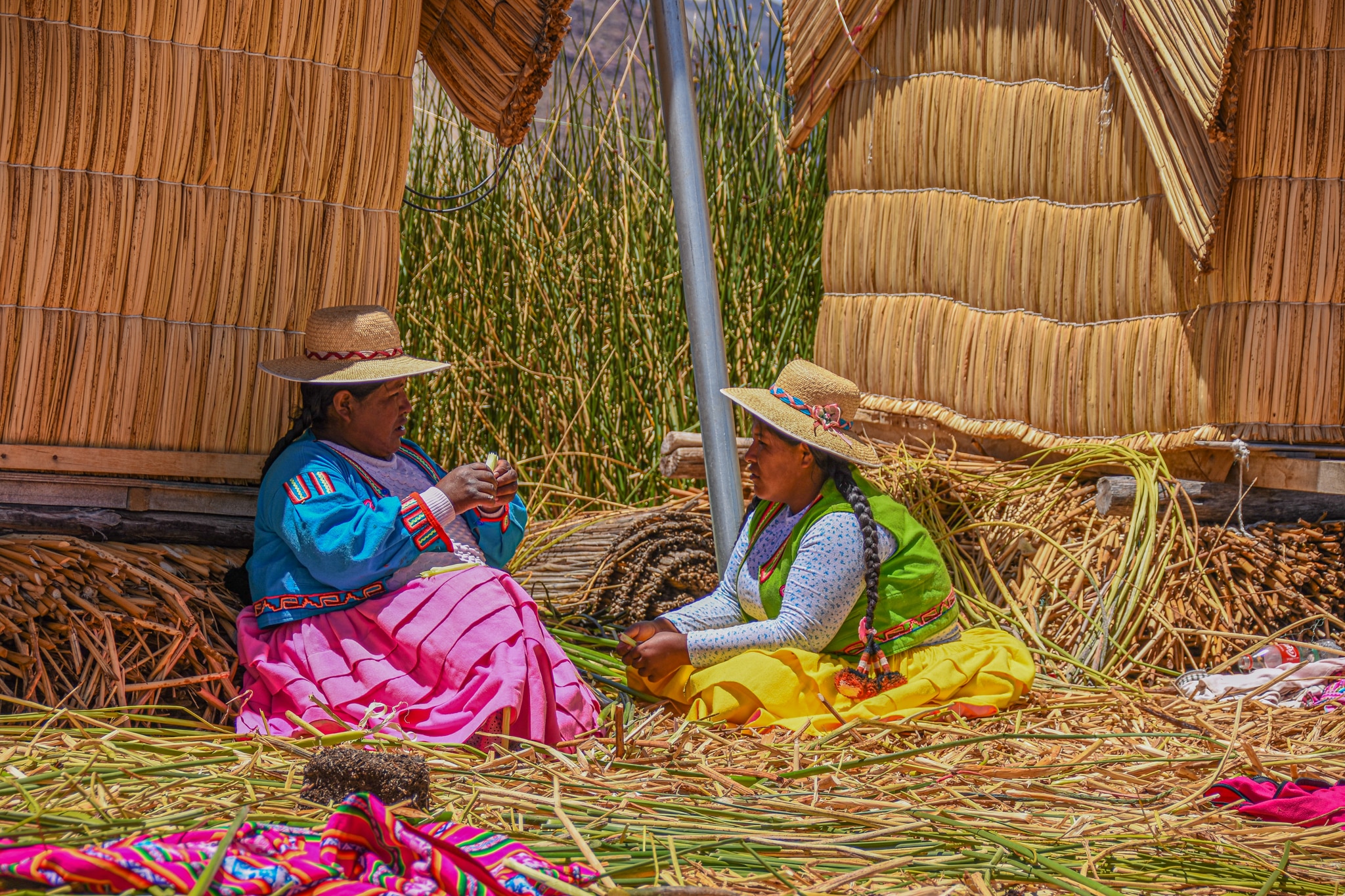 two ladies on the island of Uros, a magical moment whilst backpacking Peru